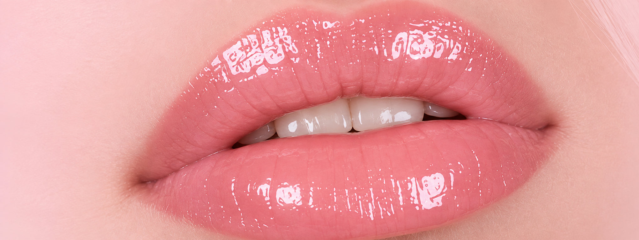 Glossy pink lips close-up